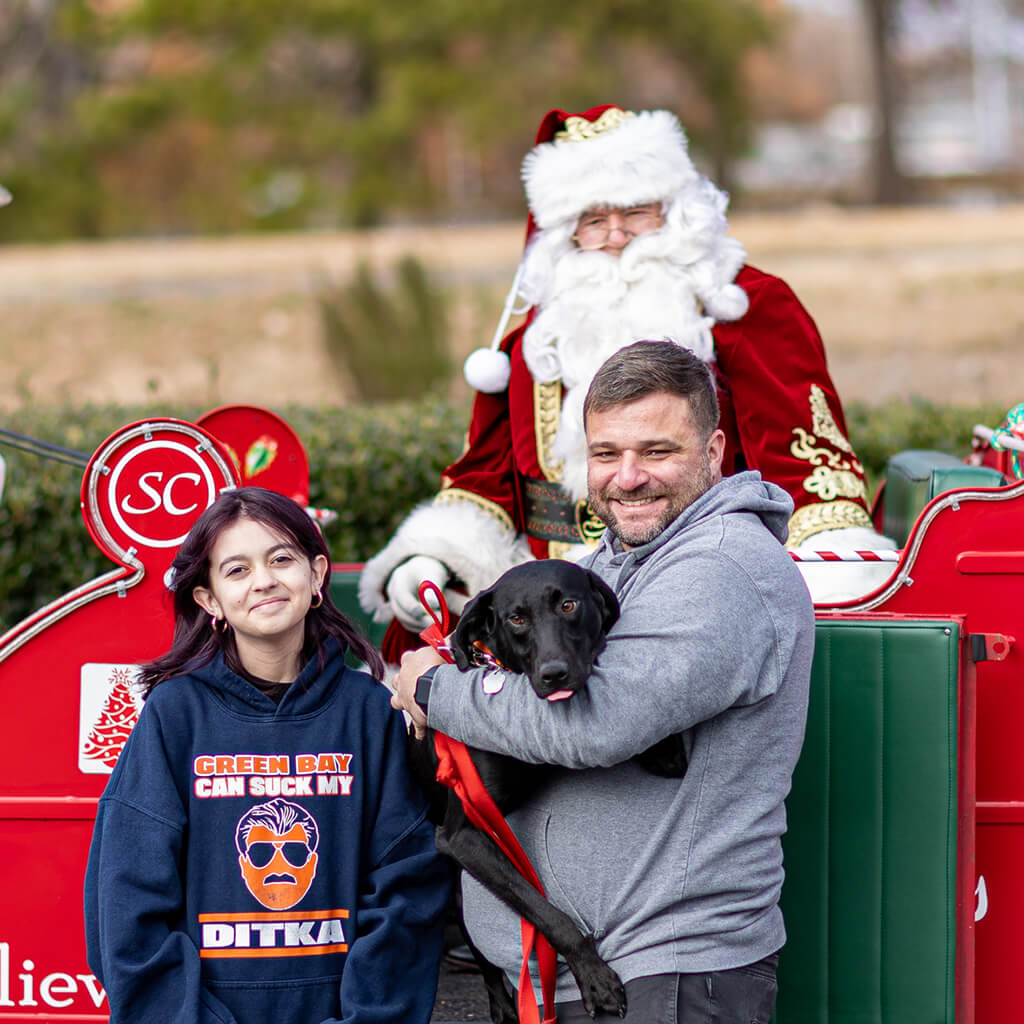 Jake and his new family pictured with Santa