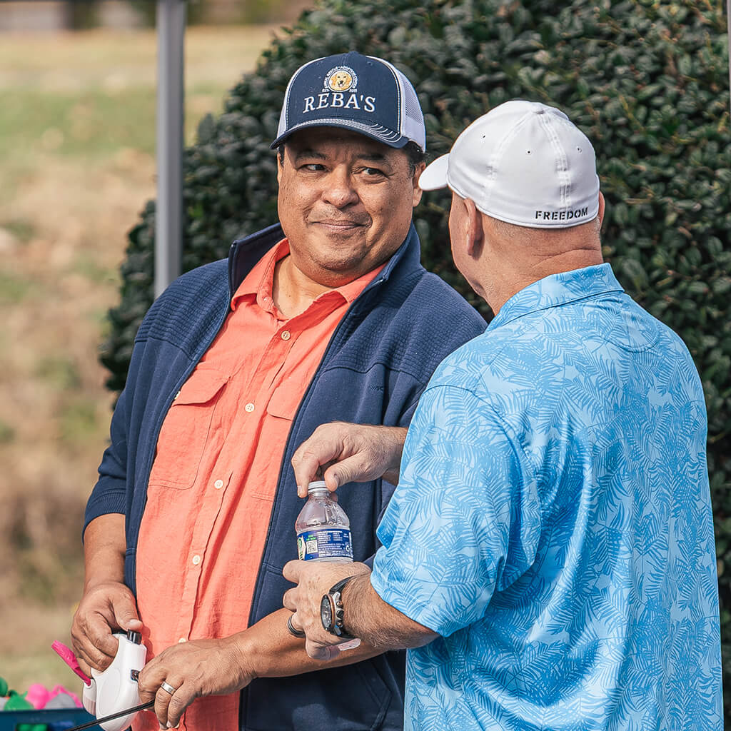 Volunteers in Reba's hats and shirts