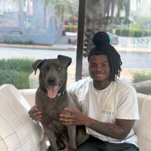 Staff photo of Antwain with adoptable dog.