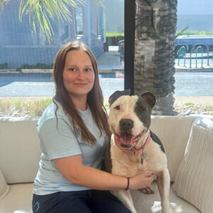 Staff photo of Ashley with adoptable dog.