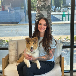 Staff photo of Tyler with adoptable dog.