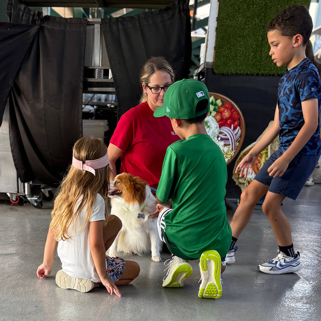 Kids socializing with one of our adoptable dogs